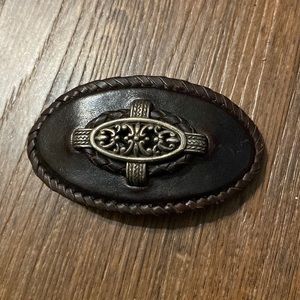 Vintage Leather barrette with metal filigree design.